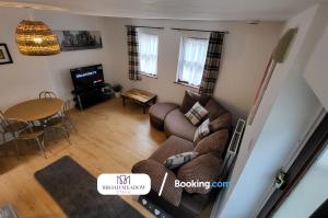 an overhead view of a living room with a couch and a table at 3 Bedroom House By Broad Meadow Stays Short Lets and Serviced Accommodation Lincoln With Parking in Lincoln