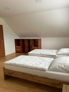 two twin beds in a room with at Vila pri kúpeľoch in Bojnice +34 photos