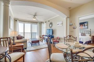 a living room with a table and a couch at Charming Condo on the Beach/Legacy T2-1102 in Gulfport