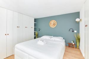 Ένα ή περισσότερα κρεβάτια σε δωμάτιο στο Montparnasse & Luxembourg Palace - CityApartmentStay