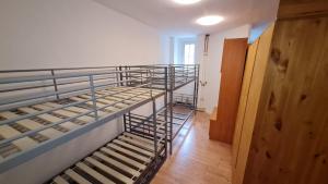 an empty room with two bunk beds in it at Rathenaustraße in Berlin