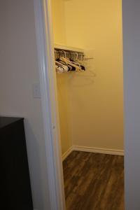 a room with a closet with a bunch of clothes at Comfortable stay five minutes away in Lawton +15 photos