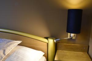A bed or beds in a room at Penzion Jople