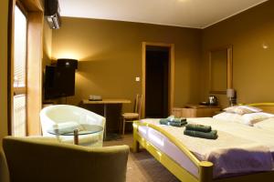 A bed or beds in a room at Penzion Jople