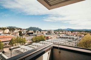 a balcony with a view of a city at Appartamento Panorama - Affitti Brevi Italia in Varese