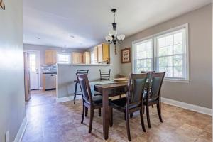 a kitchen and dining room with a table and chairs at Single Family Home in Rossville GA! in Rossville