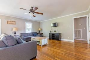a living room with a couch and a ceiling fan at Single Family Home in Rossville GA! in Rossville