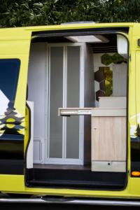 a door on the side of a yellow bus at Camper On Road Tenerife in Los Cristianos