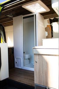 a bathroom with a toilet in the back of a caravan at Camper On Road Tenerife in Los Cristianos