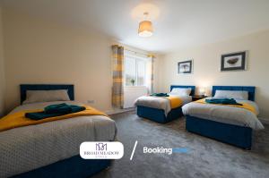 a bedroom with two beds and a window at 2 Bedroom, Brand new property By Broad Meadow Stays Short Lets and Serviced Accommodation Lincoln With Garden in Lincoln