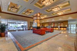 a lobby with couches and tables in a building at MGM Signature-24-709 Strip View Jacuzzi Studio in Las Vegas