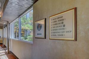 a sign on a wall next to a window at MGM Signature-24-709 Strip View Jacuzzi Studio in Las Vegas