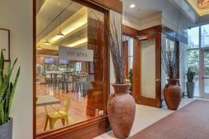 a store with two large vases in front of a window at MGM Signature-24-709 Strip View Jacuzzi Studio in Las Vegas