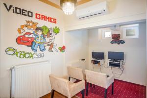 TV a/nebo společenská místnost v ubytování Hotel Piroska