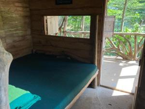 Een bed of bedden in een kamer bij Wisdom Resort