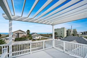 a view from the balcony of a house at Mod Studio - 100 Steps to the Beach, Pets OK, Private Deck! in St. Augustine