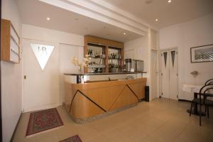 a kitchen with a counter in a room at Hotel Brunella in Rimini