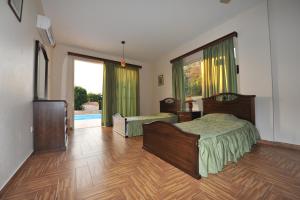 Postel nebo postele na pokoji v ubytování Jaime Villa Cyprus