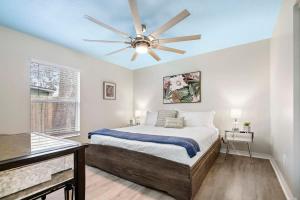 a bedroom with a bed and a ceiling fan at Uptown Gem The Castaway Cottage, Dog Friendly! in Saint Augustine