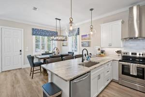 a kitchen with a sink and a counter top at Lincolnville Luxe Upscale Home in Heart of St Aug in St. Augustine
