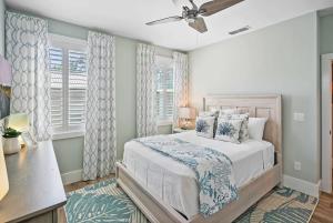 a bedroom with a bed and a ceiling fan at Lincolnville Luxe Upscale Home in Heart of St Aug in Saint Augustine