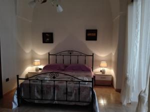 מיטה או מיטות בחדר ב-Il melograno b&b