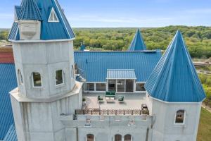 an aerial view of a house with a blue roof at Extravagant 3 Level Penthouse at The Grand Castle in Grandville