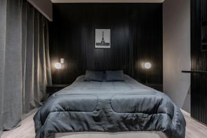 Кровать или кровати в номере Monoambiente Simil Hotel Lujoso