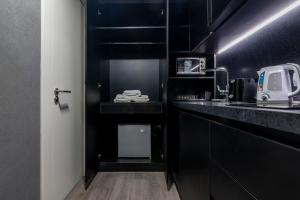 Кухня или мини-кухня в Monoambiente Simil Hotel Lujoso
