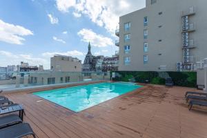 a swimming pool on the roof of a building at Museo Paseo de la Cisterna, UF 431 in Buenos Aires