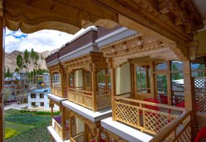 a view from the balcony of a wooden house at The Nangsay Hotel in Leh