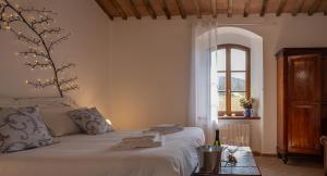 Posteľ alebo postele v izbe v ubytovaní Ca'Novae - Tuscany Farmhouse
