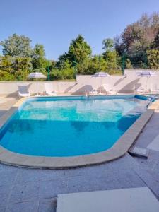 a large blue swimming pool with a skate park at Квартира студия на берегу моря in Byala