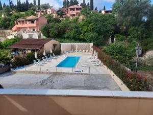 a view of a swimming pool in a house at Spiridoula's Apartments Corfu in Perama