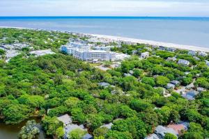 an aerial view of a resort next to the ocean at The Palm Frond Stay in Isle of Palms