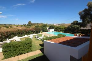 a view of a backyard with a swimming pool at Casa Mar in Burgau