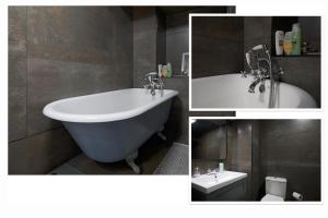 a bathroom with a tub and a toilet and a sink at Luxurious Park District Duplex Apartment in Glasgow
