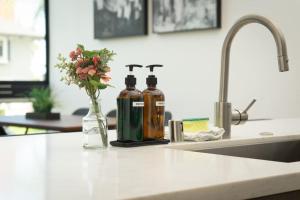 two bottles of alcohol sitting on a kitchen counter at Bright and Trendy 2-story Bankers Hill Condo in San Diego