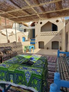 a large room with a table and a stage at Nubian Heights in Aswan