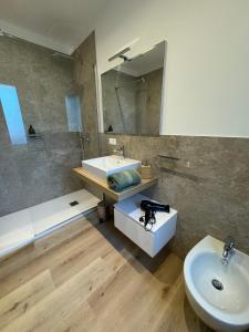 a bathroom with a sink and a mirror at Casa Prabi in Arco