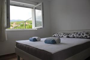 Postel nebo postele na pokoji v ubytování Apartments Bonaca Rovanjska