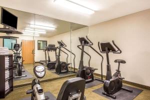 a gym with several exercise bikes and a mirror at Metro Tempe Extended Stay - King Studio in Tempe