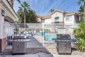 a house with a grill and a swimming pool at Chandler Promo 1bd 1ba in Chandler