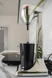 a blender sitting on top of a counter at Fox Apartment in Gevgelija