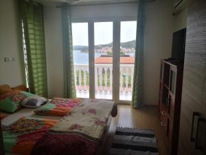Posteľ alebo postele v izbe v ubytovaní Judith Apartment