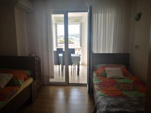 Posteľ alebo postele v izbe v ubytovaní Judith Apartment