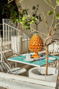 a table with a pineapple on top of it at Il Trappetello in Monopoli