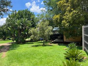 a garden with a gazebo in a yard at Miami Gardens in Roodepoort