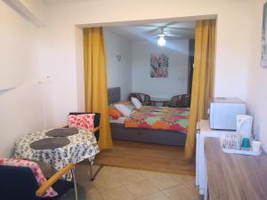 Posteľ alebo postele v izbe v ubytovaní Judith Apartment