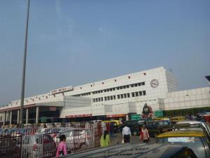 a building with a lot of cars in front of it at Hotel Kabeer By A1Rooms in New Delhi